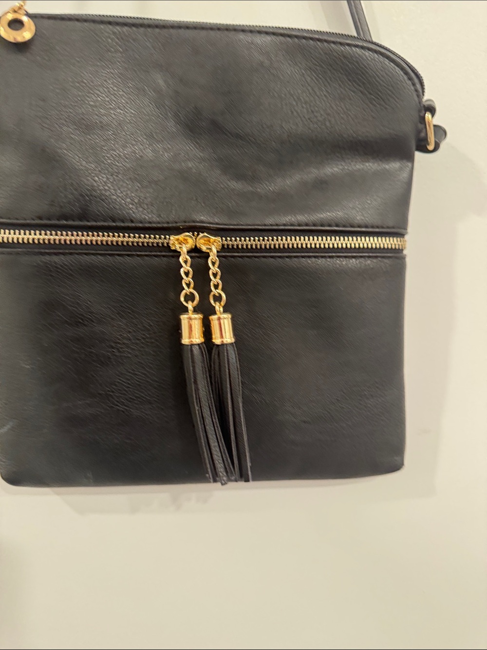 Classic Black Crossbody Bag with Gold Tassel Accents - Picture 2 of 5